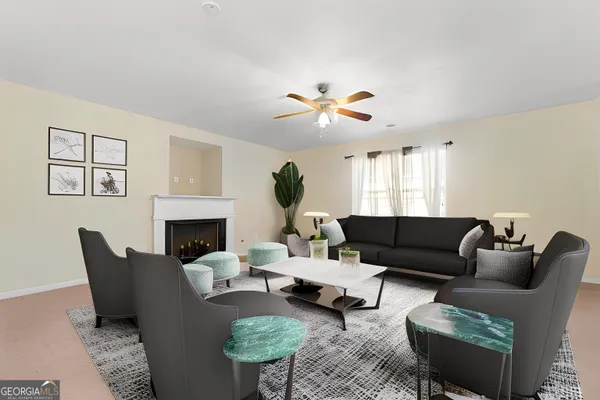 a living room with furniture a fireplace and a window