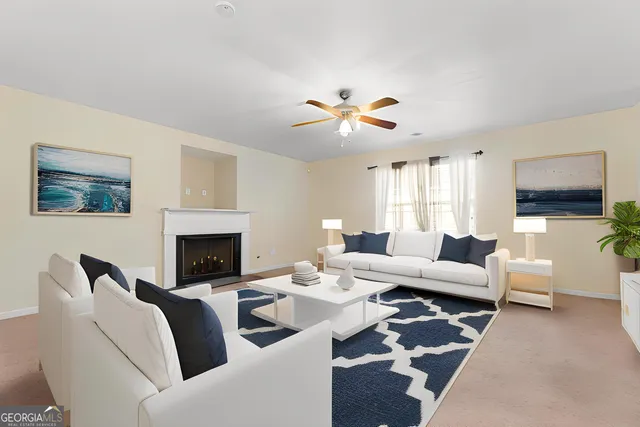 a living room with furniture fireplace and a flat screen tv
