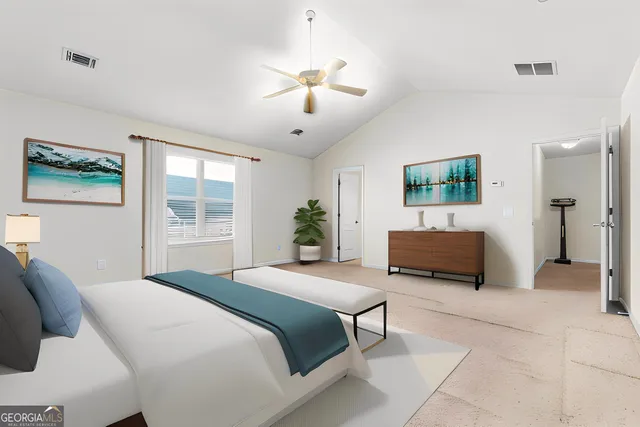 a spacious bedroom with a large bed a chandelier and windows