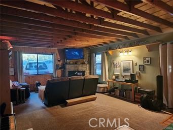 3 Glacier Mount Baldy, CA 91759 - Photo 11 of 49 a living room with furniture and a flat screen tv