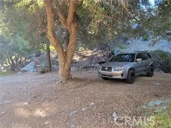 a view of a car parked in a yard