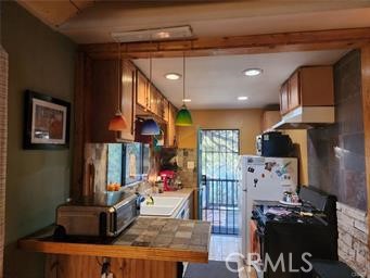 3 Glacier Mount Baldy, CA 91759 - Photo 20 of 49 a kitchen with stainless steel appliances granite countertop a stove and a refrigerator