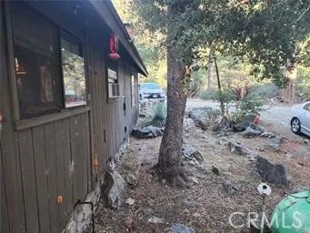 a living room with furniture a fireplace and window