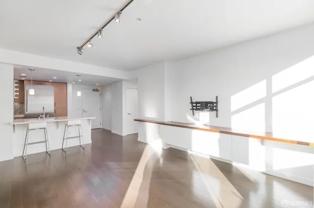 a bathroom with a large mirror and shower