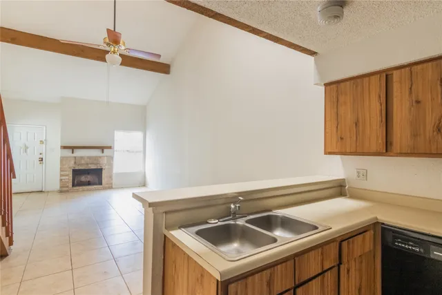 a kitchen with a sink and a microwave