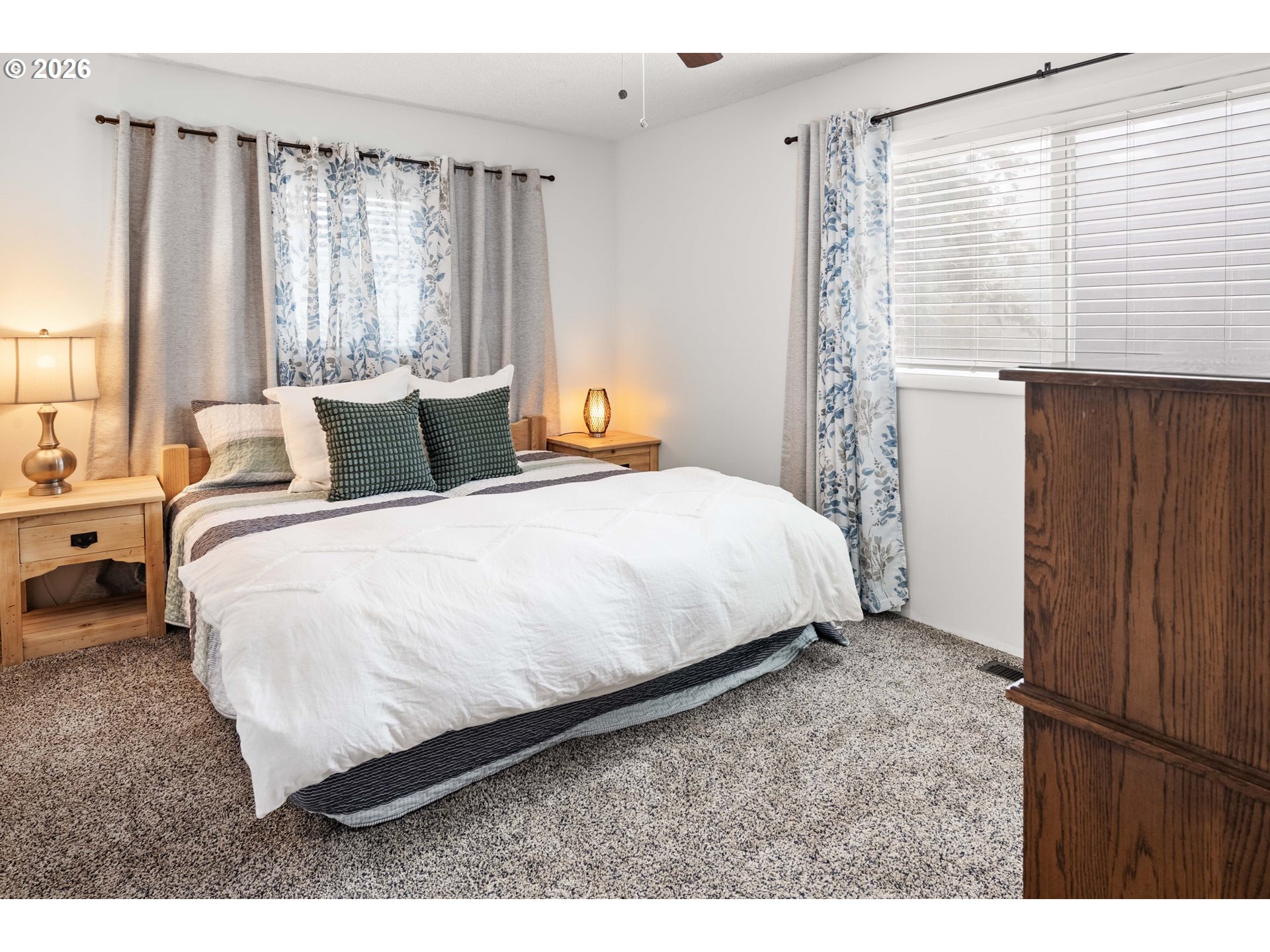 91614 George Hill Road Astoria, OR 97103 - Photo 16 of 44 a large bed sitting in a bedroom next to a window