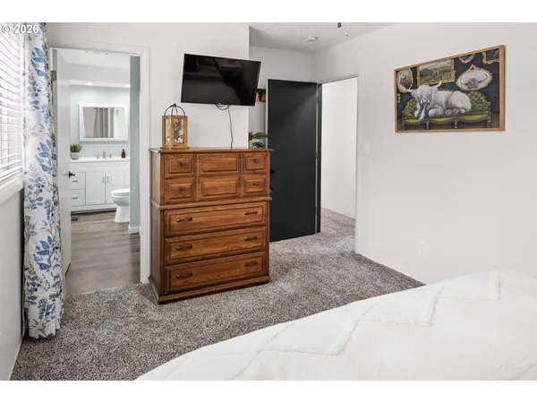 a view of a livingroom with furniture and cabinet