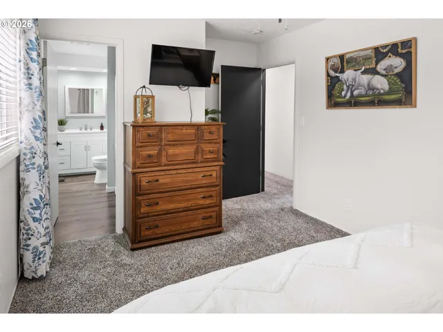 a view of a livingroom with furniture and cabinet