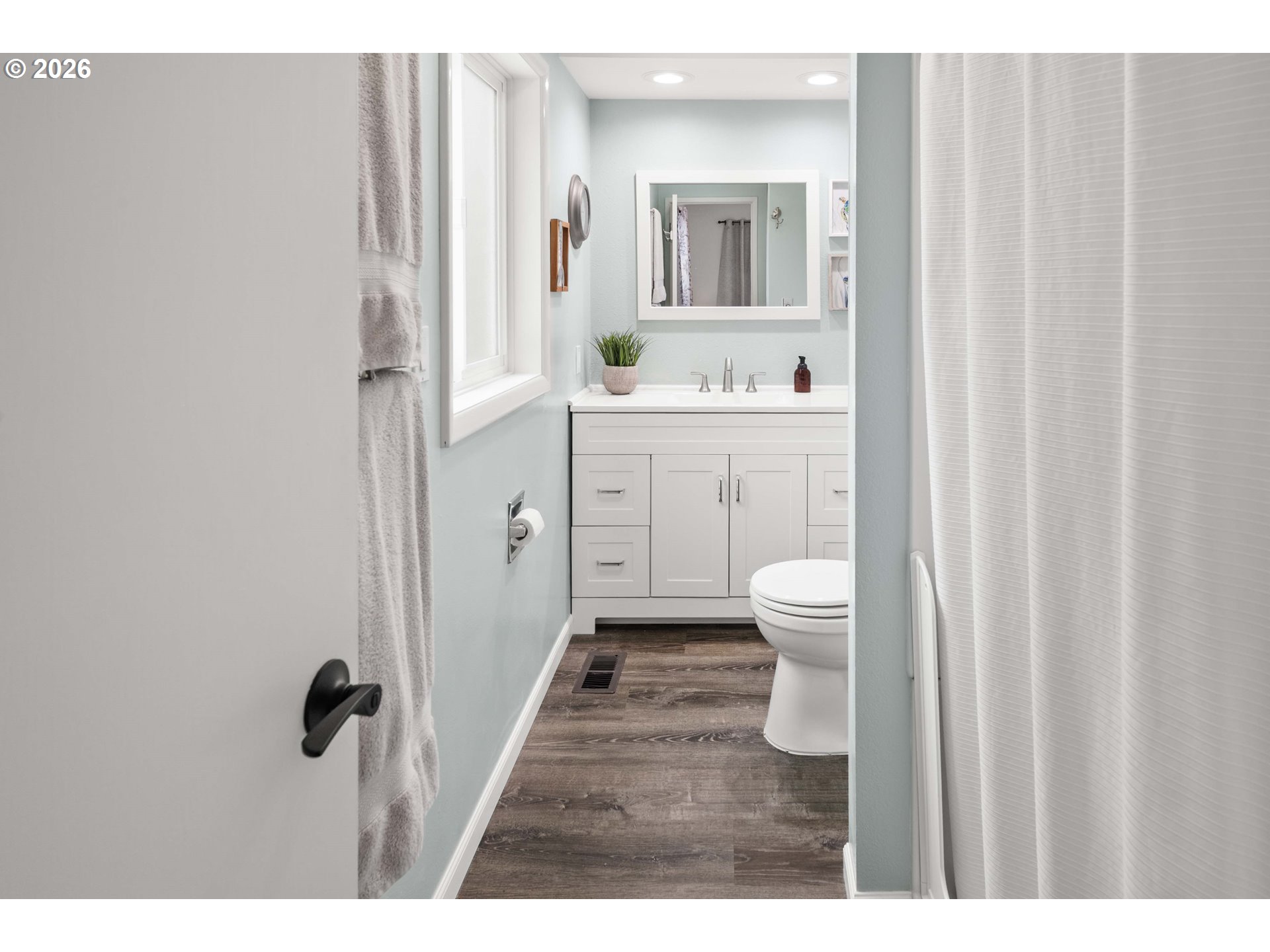 91614 George Hill Road Astoria, OR 97103 - Photo 18 of 44 a bathroom with a sink a toilet and a mirror