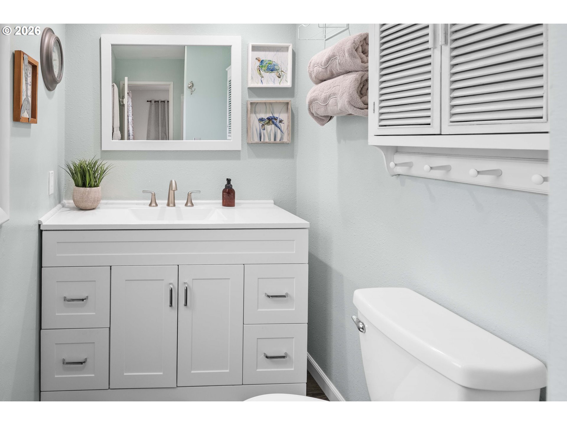91614 George Hill Road Astoria, OR 97103 - Photo 19 of 44 a bathroom with a sink a toilet and a window