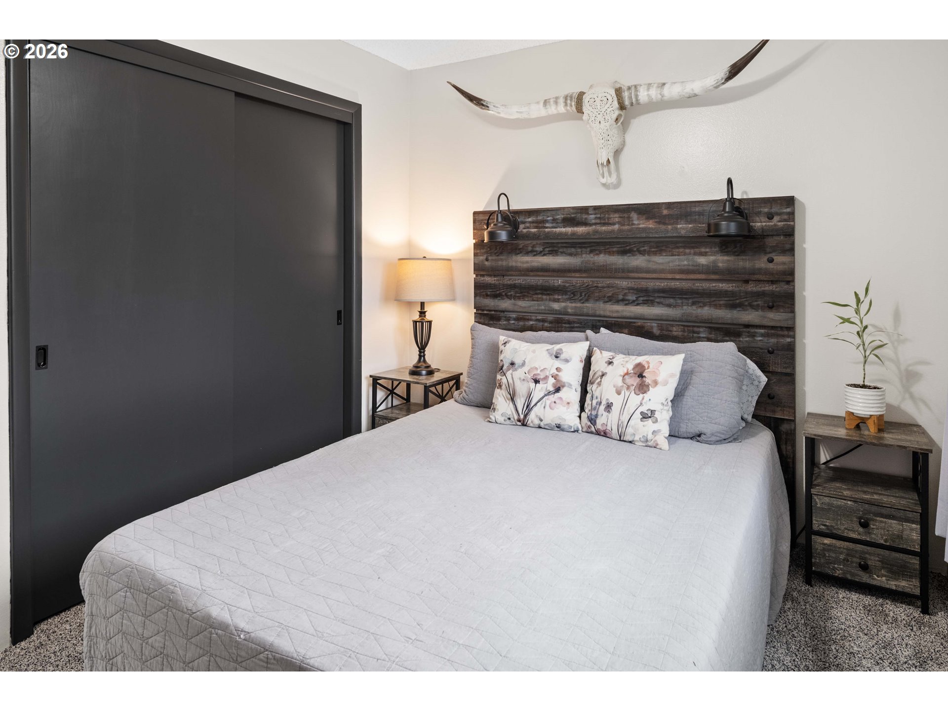 91614 George Hill Road Astoria, OR 97103 - Photo 21 of 44 a bedroom with a bed and wooden floor