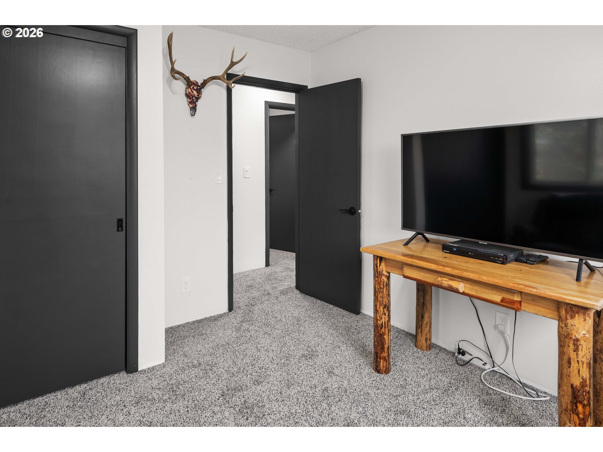 91614 George Hill Road Astoria, OR 97103 - Photo 24 of 44 a living room with flat screen tv and furniture