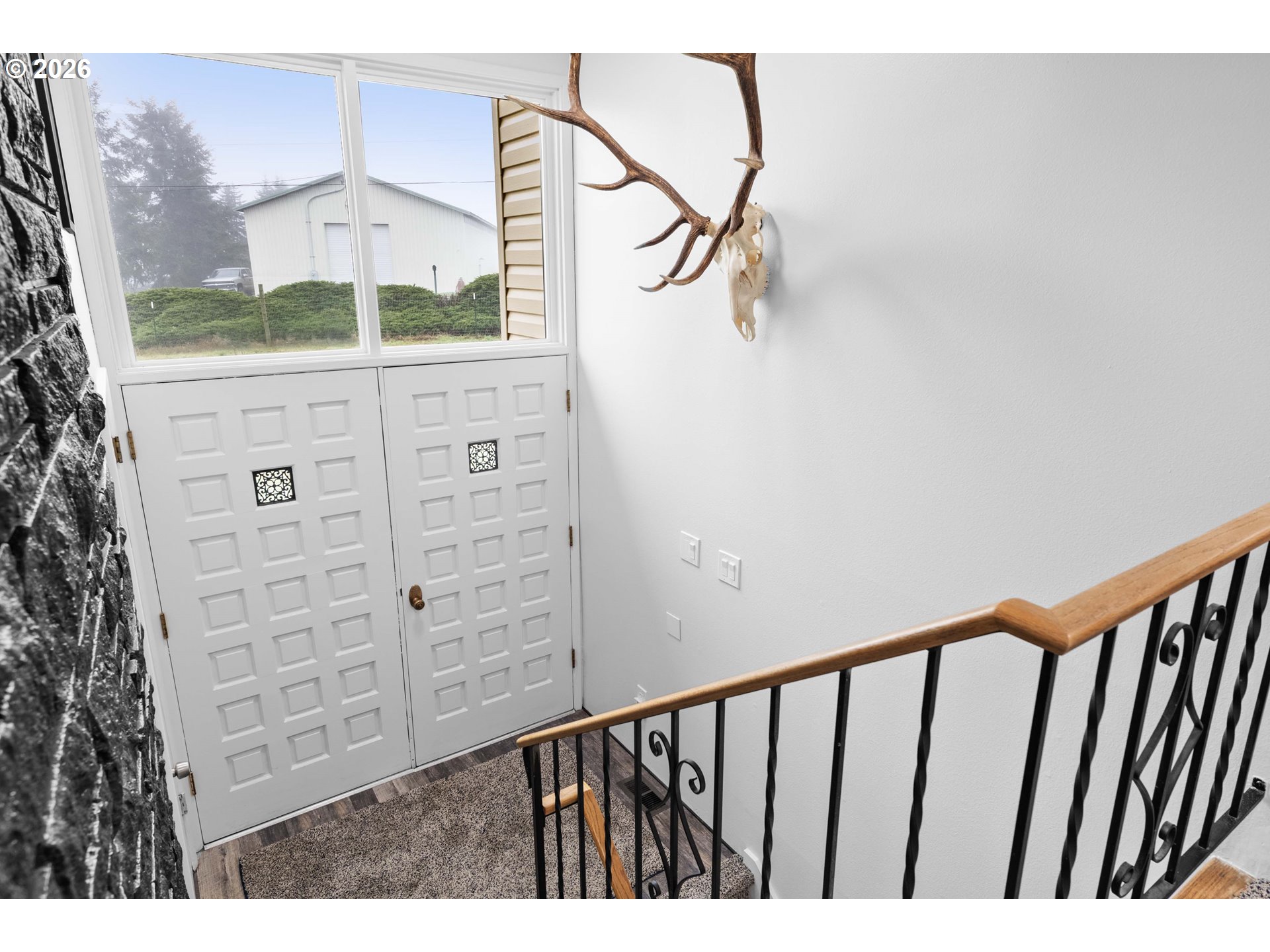 91614 George Hill Road Astoria, OR 97103 - Photo 25 of 44 a view of a hallway with stairs