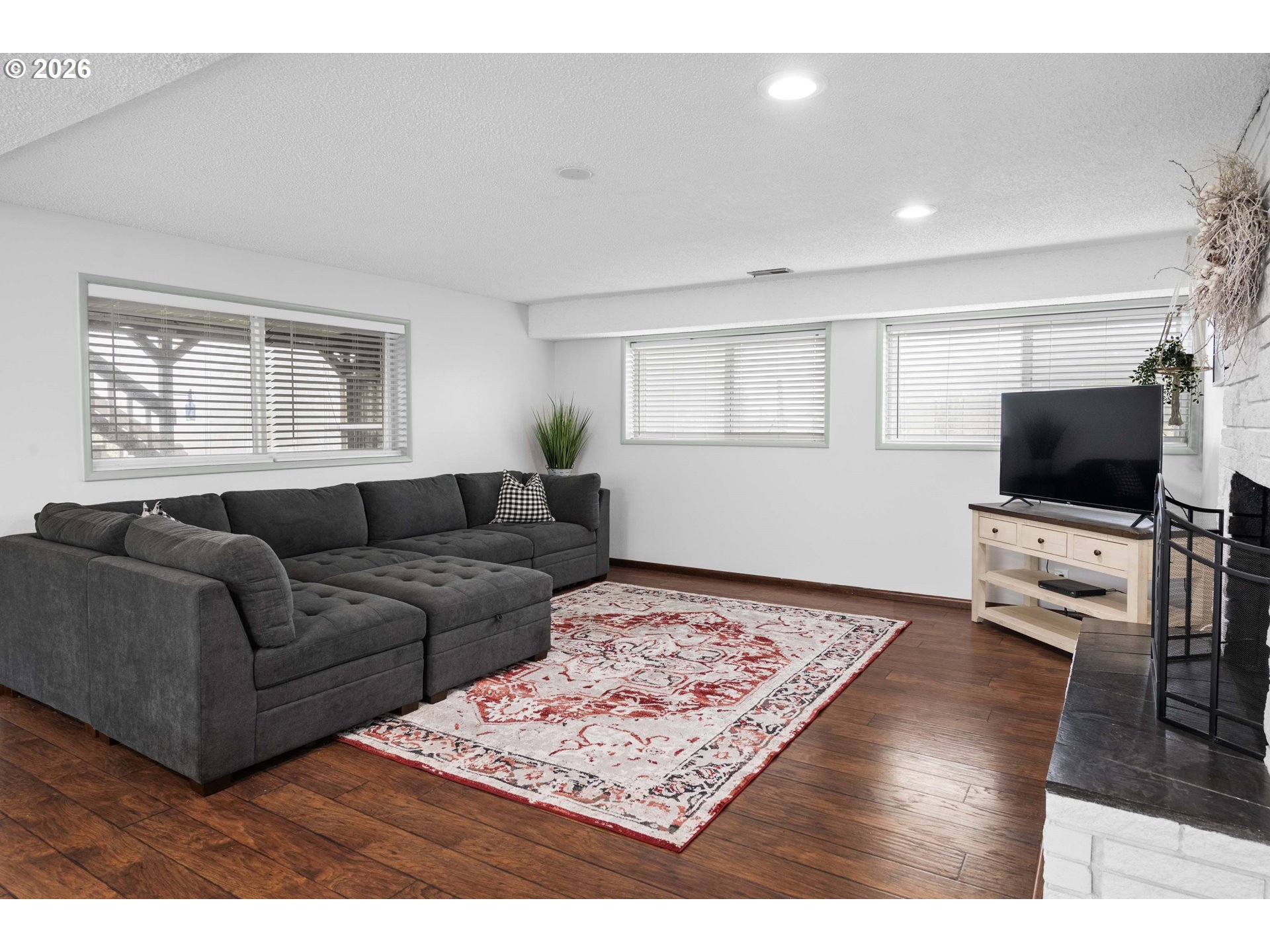 91614 George Hill Road Astoria, OR 97103 - Photo 26 of 44 a living room with furniture and a flat screen tv