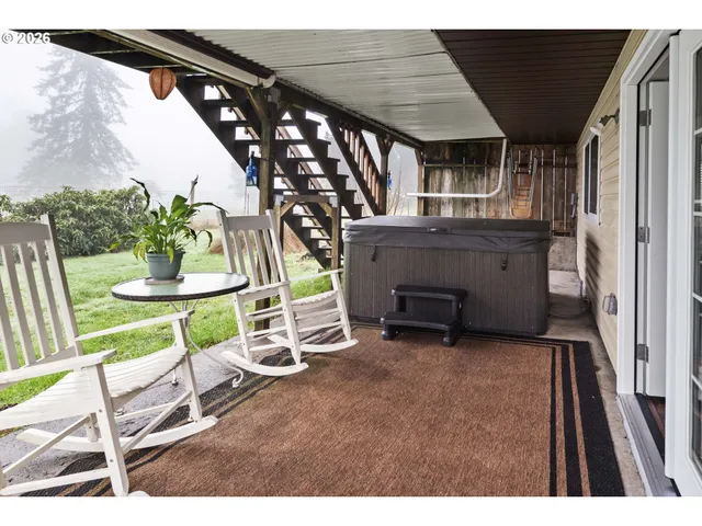 a view of an chairs and table in the balcony
