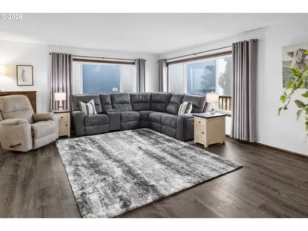 a living room with a couch and a window