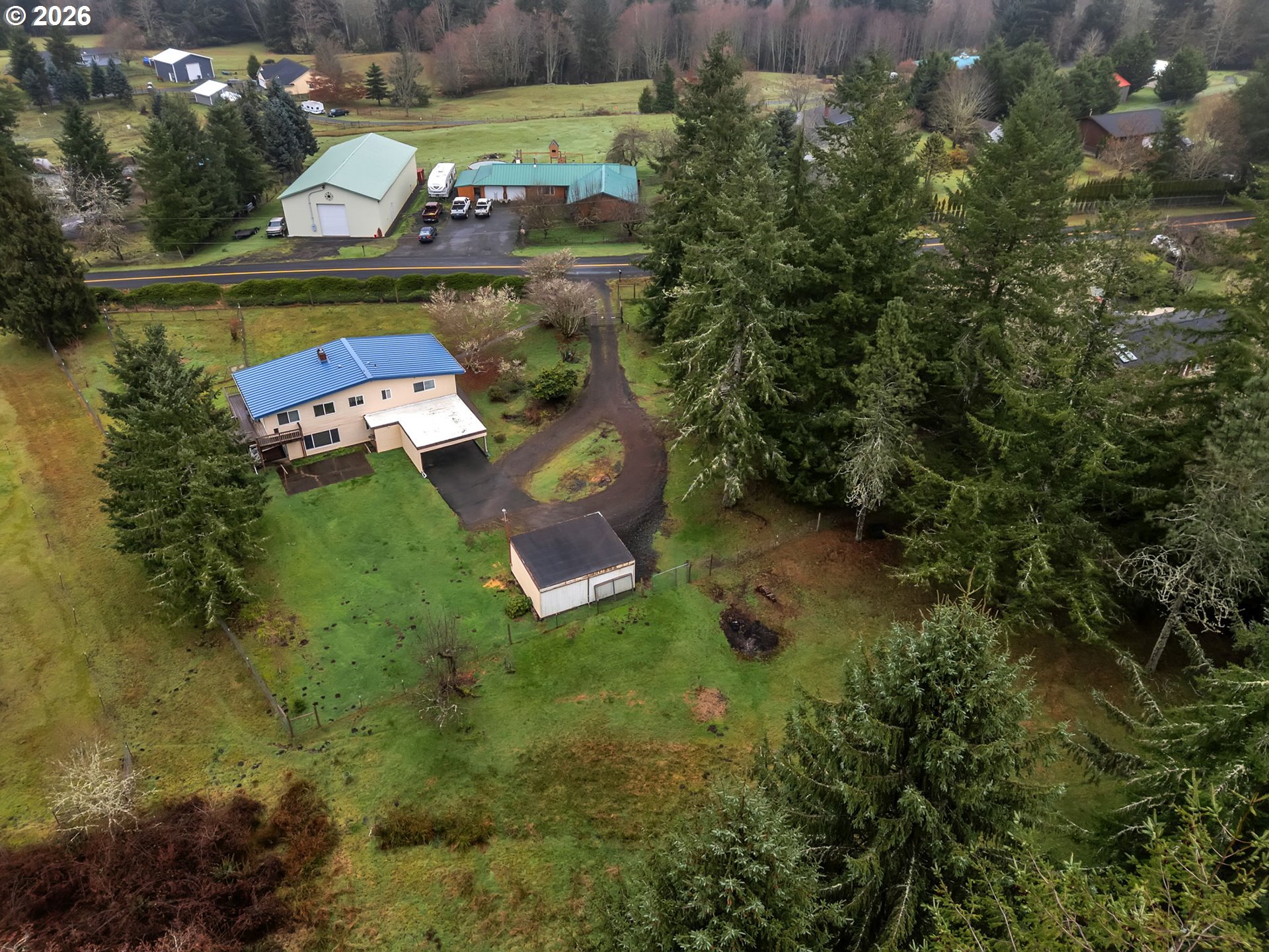 91614 George Hill Road Astoria, OR 97103 - Photo 41 of 44 an aerial view of a house with swimming pool outdoor seating and yard
