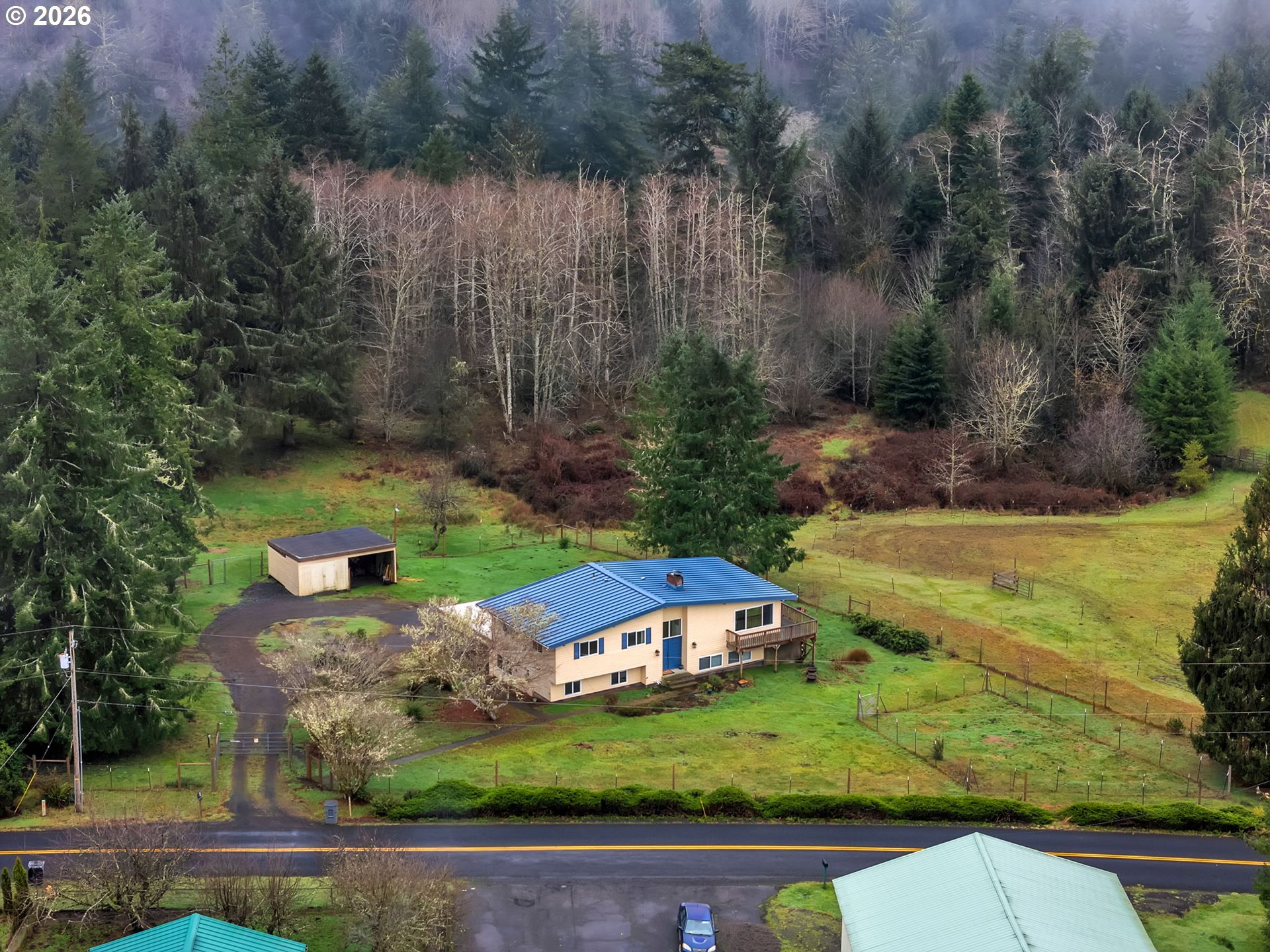 91614 George Hill Road Astoria, OR 97103 - Photo 43 of 44 an aerial view of a house with a yard