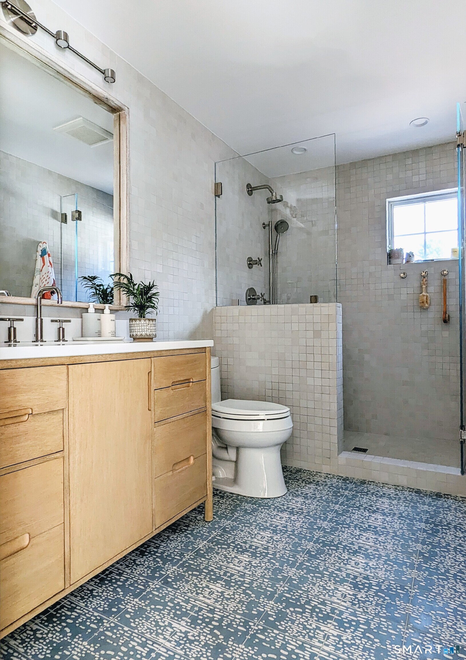 85 Garnet Park Road Madison, CT 06443 - Photo 16 of 40 a bathroom with a sink a toilet and mirror