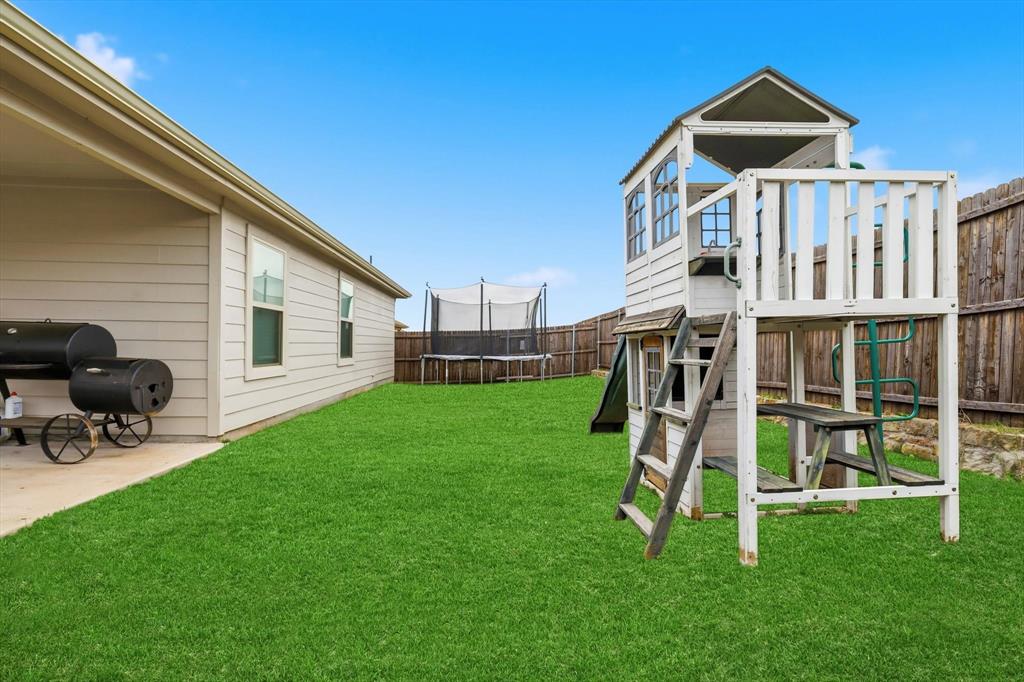 2416 Wildhaven Road Crandall, TX 75114 - Photo 27 of 35 a view of a house with a yard