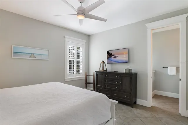 a bedroom with a bed and a table in it