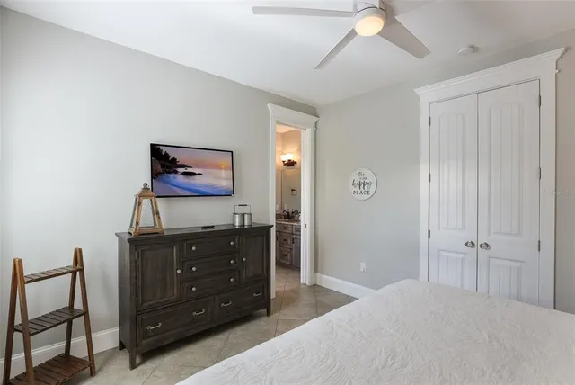 a view of deck with chairs and wooden fence