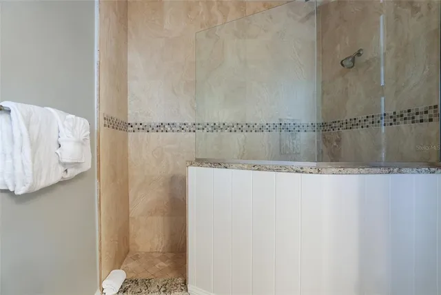 a view of a swimming pool with outdoor seating