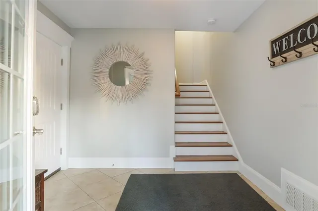 a kitchen with stainless steel appliances kitchen island granite countertop a refrigerator and a stove top oven