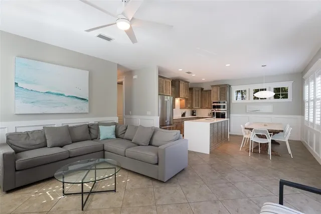 a kitchen with a stove a sink a counter space and windows
