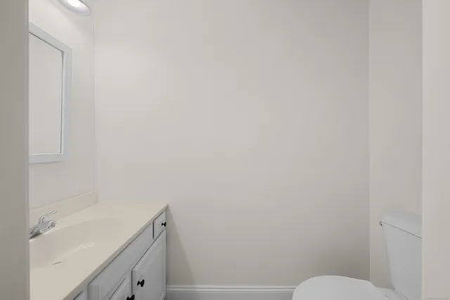 a bathroom with a sink and toilet