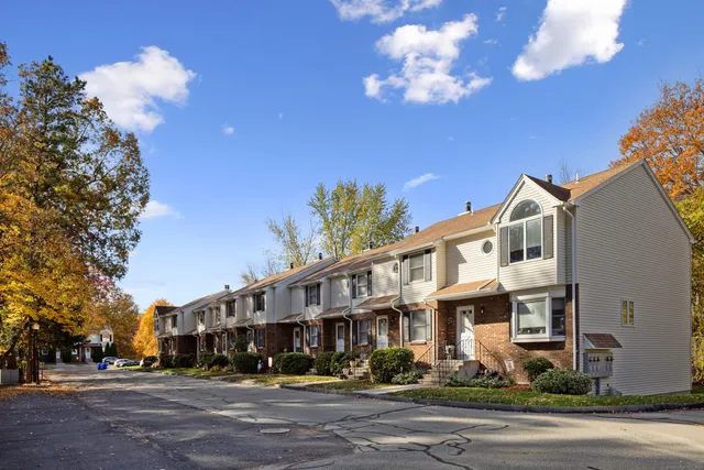 a front view of a building with street view