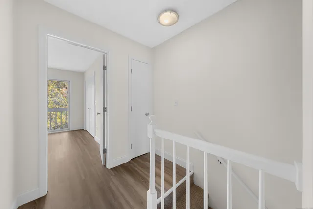 a view of entryway with wooden floor
