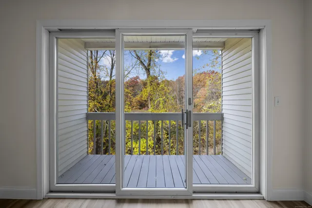 a view of a glass door with a glass door and windows