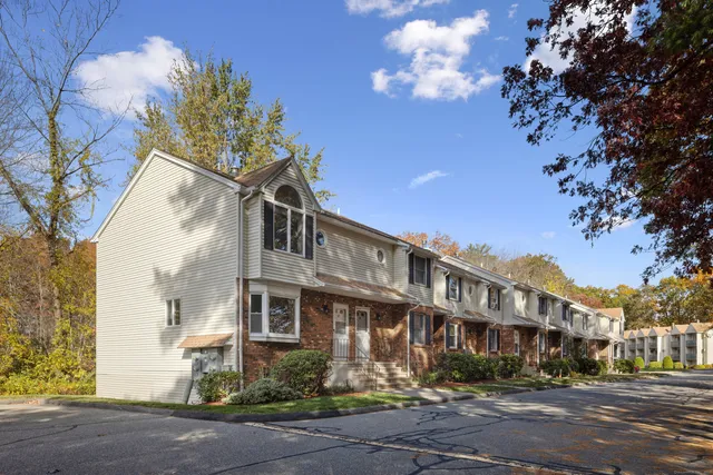 a front view of a building with street view
