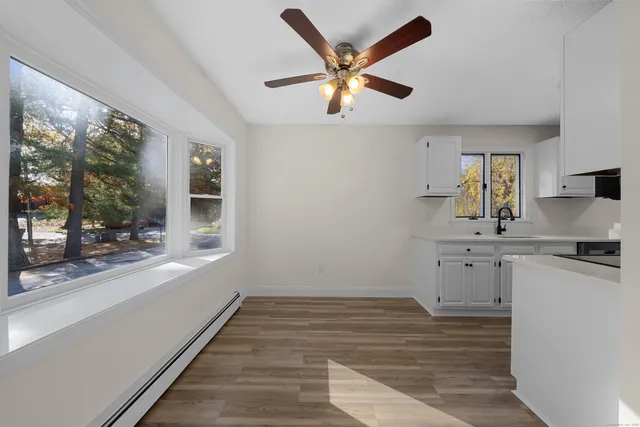 a kitchen with a stove a refrigerator and a sink