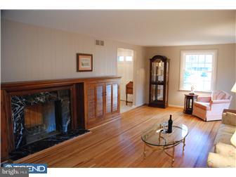 132 Pearl Croft Road Cherry Hill, NJ 08034 - Photo 2 of 12 a living room with furniture and a fireplace