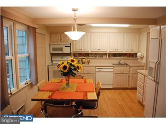 132 Pearl Croft Road Cherry Hill, NJ 08034 - Photo 4 of 12 a view of a kitchen with kitchen island a counter space a sink appliances and cabinets