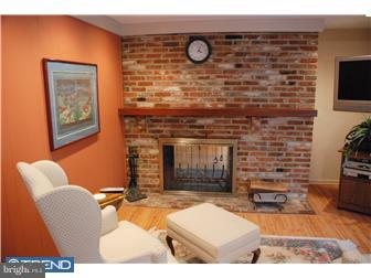 132 Pearl Croft Road Cherry Hill, NJ 08034 - Photo 6 of 12 a living room with furniture a flat screen tv and a fireplace