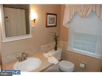132 Pearl Croft Road Cherry Hill, NJ 08034 - Photo 9 of 12 a bathroom with a sink and a mirror