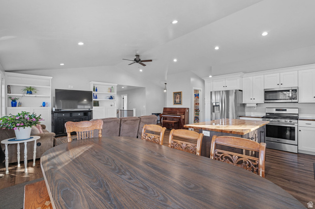 75 North 100th Street West Fillmore, UT 84631 - Photo 4 of 62 Dining area with dark wood-style floors, vaulted ceiling, built in shelves, recessed lighting, and a ceiling fan
