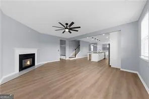 a view of a livingroom with a fireplace and cabinet