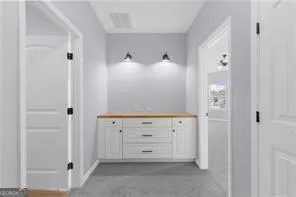 a view of a hallway with staircase