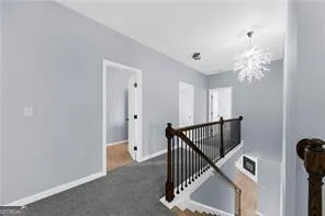 an empty room with a window and a ceiling fan