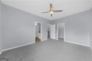 a bathroom with a toilet and a bathtub