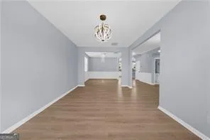 a view of an entryway with wooden floor