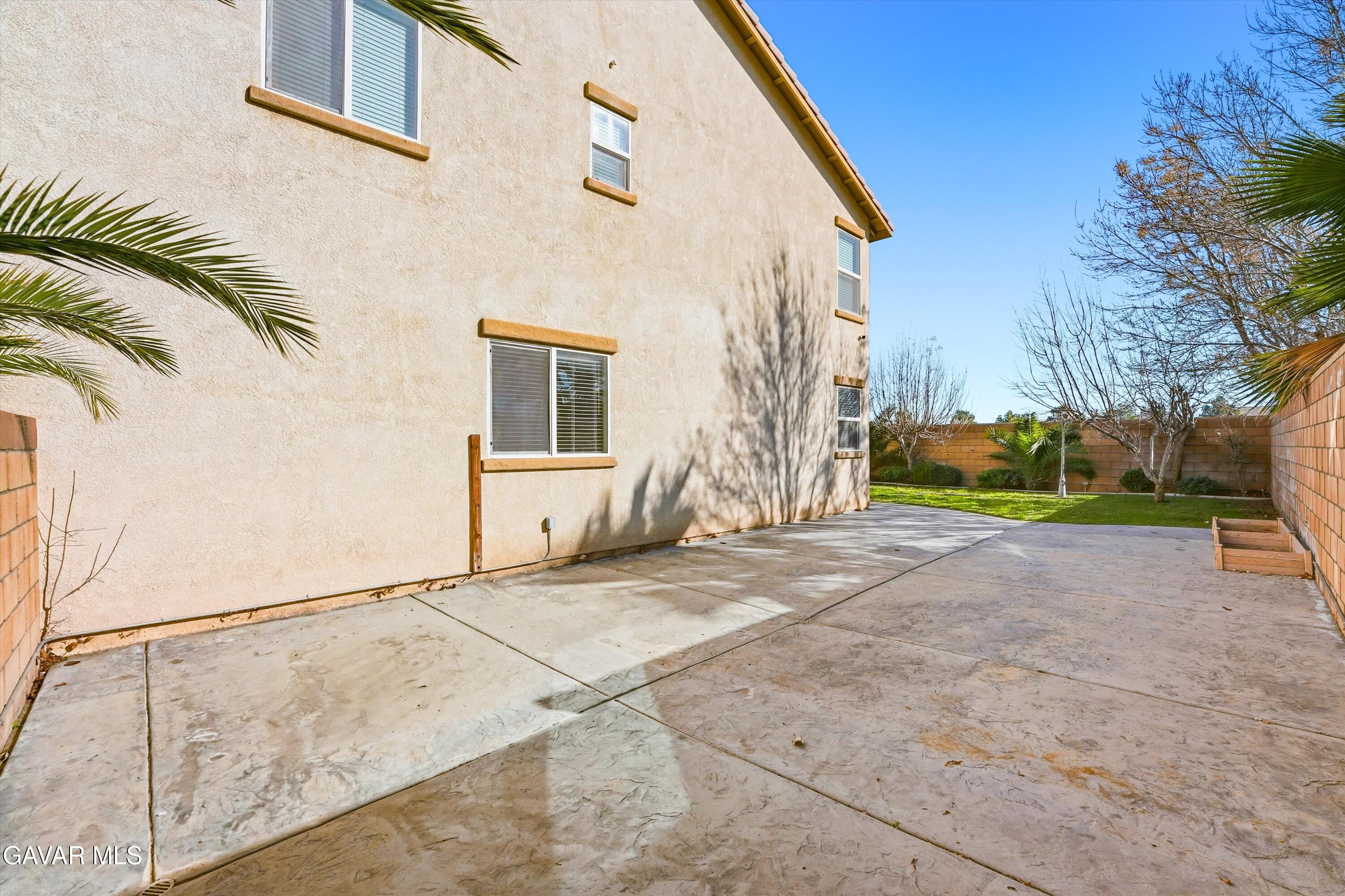 44232 Begonia Street Lancaster, CA 93535 - Photo 18 of 39 a view of backyard with wheel chair