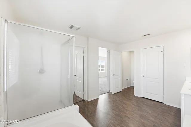 a view of a bathroom with shower