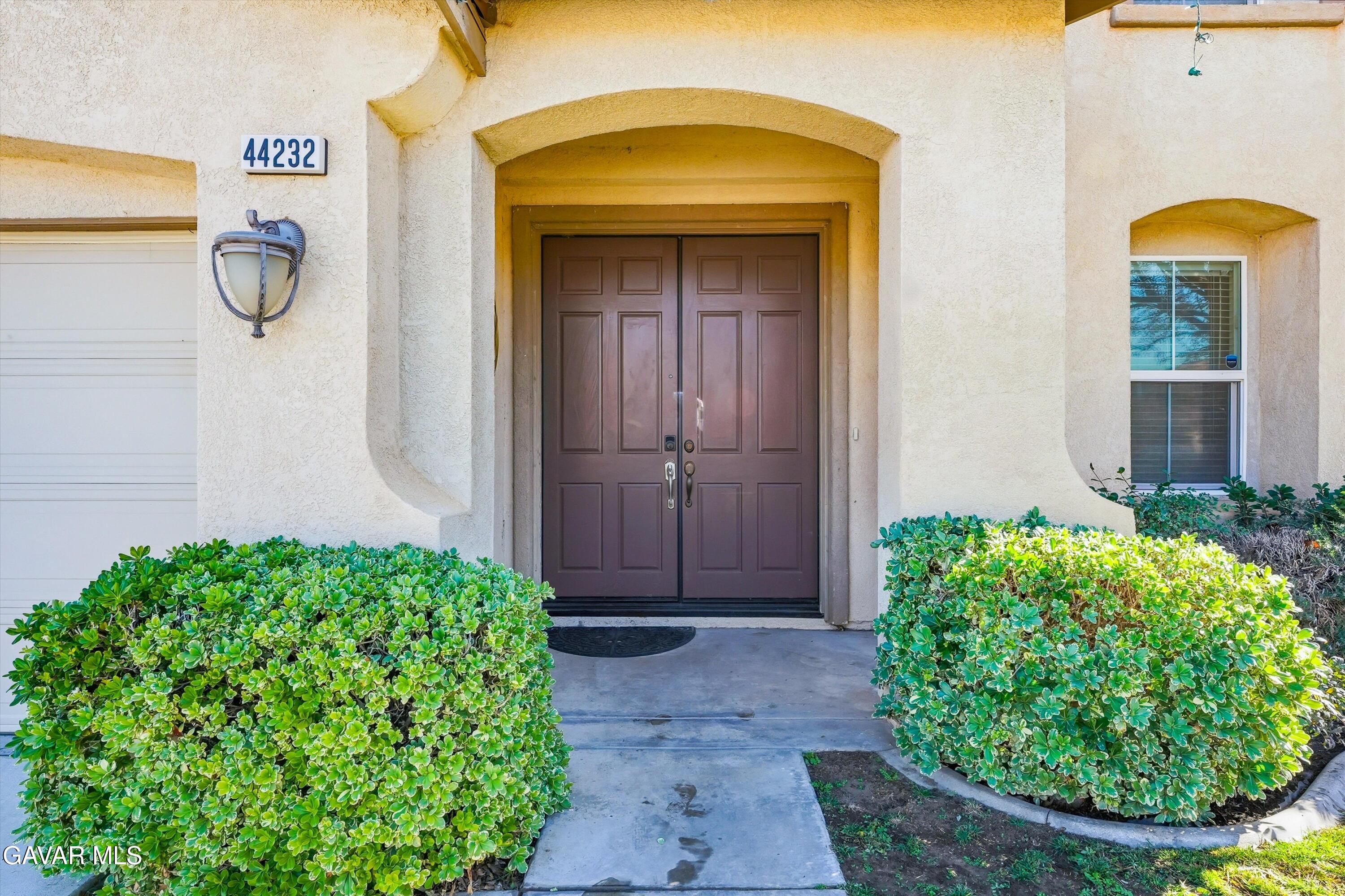44232 Begonia Street Lancaster, CA 93535 - Photo 3 of 39 a view of a front door of the house
