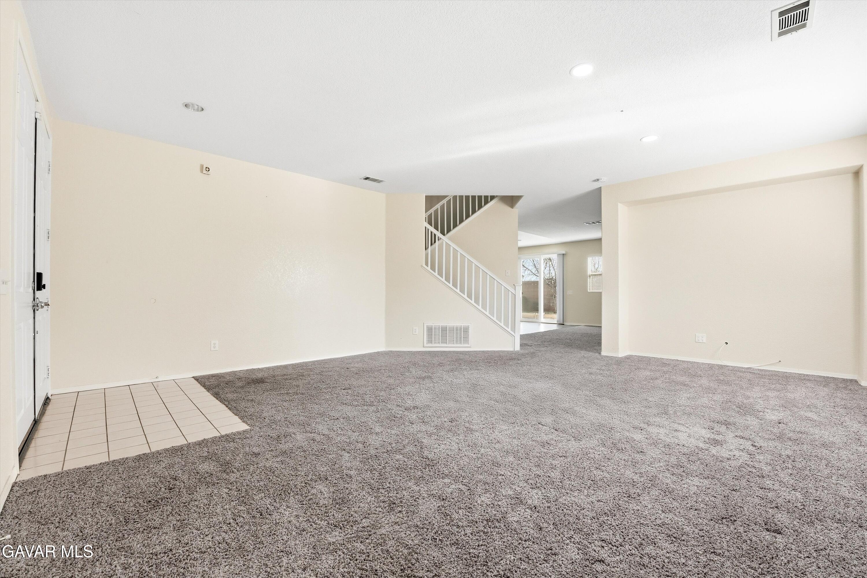 44232 Begonia Street Lancaster, CA 93535 - Photo 5 of 39 an empty room with a natural light
