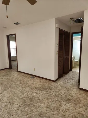 a view of a room with a hallway